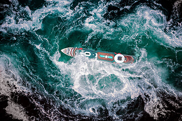 Image showing Storm waves of the sea around the ship.