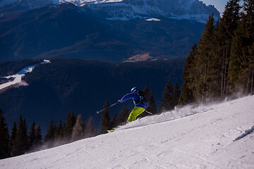 Image showing Skier having fun while running downhill