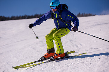 Image showing Skier having fun while running downhill