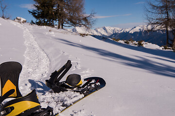 Image showing snowboard in snow