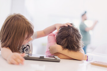 Image showing cute little brother and sister having fun at home