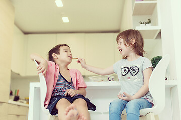 Image showing cute little brother and sister at home