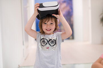 Image showing little girl at home wearing vr glasses