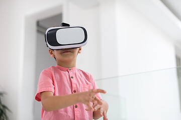 Image showing kid at home playing games on vr glasses