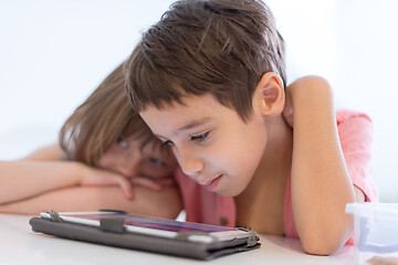 Image showing cute little brother and sister having fun at home