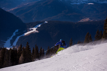 Image showing Skier having fun while running downhill