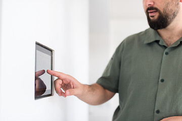 Image showing smart home and technology concept close up of male hands