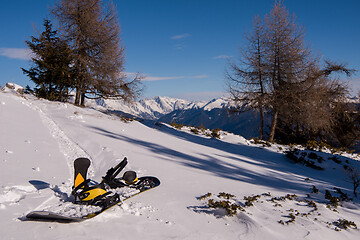 Image showing snowboard in snow