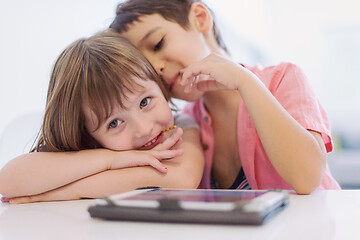 Image showing cute little brother and sister having fun at home