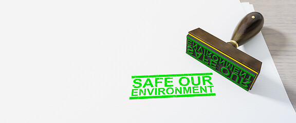 Image showing green safe our environment stamp on white paper background