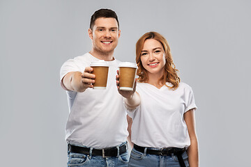 Image showing portrait of happy couple with takeaway coffee cups