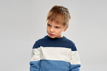 Image showing portrait of gloomy little boy in striped pullover