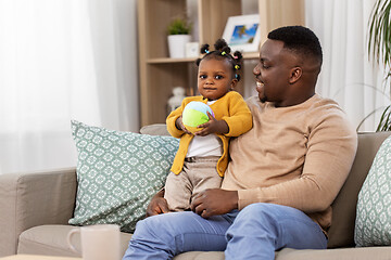 Image showing happy african american father with baby at home