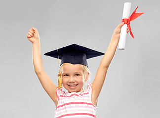 Image showing happy little girl in mortarboard with diploma