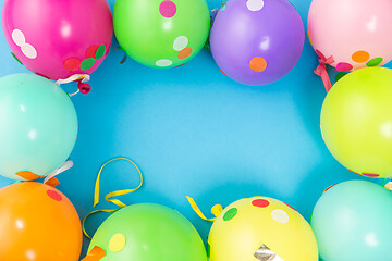 Image showing party balloons and confetti on blue background