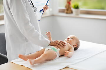 Image showing female pediatrician doctor with baby at clinic