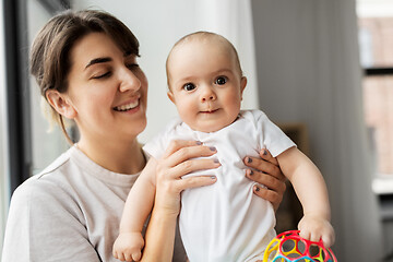 Image showing happy young mother holding little baby daughter