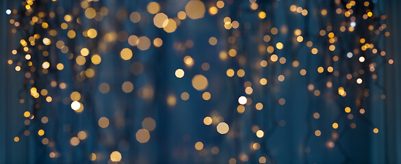 Image showing christmas garland lights over dark blue background