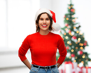 Image showing happy young woman in santa hat on christmas