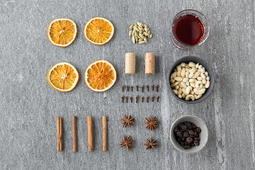 Image showing hot mulled wine, orange slices, raisins and spices