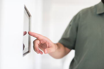 Image showing smart home and technology concept close up of male hands