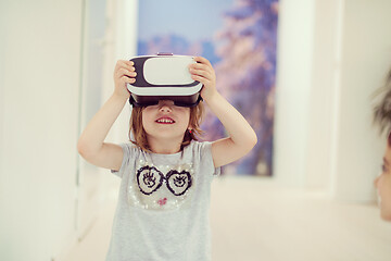 Image showing little girl at home wearing vr glasses