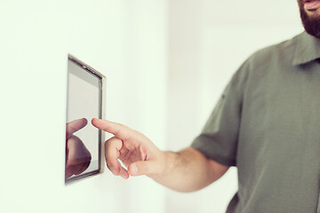 Image showing smart home and technology concept close up of male hands