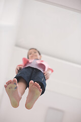 Image showing little boy standing on transparent glass floor