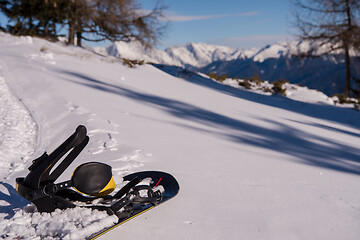 Image showing snowboard in snow