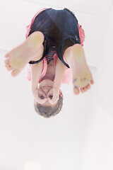 Image showing little boy standing on transparent glass floor