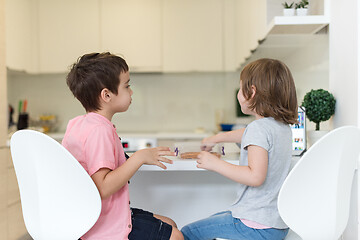 Image showing cute little brother and sister at home