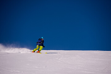 Image showing Skier having fun while running downhill