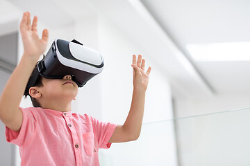 Image showing kid at home playing games on vr glasses