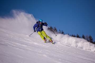 Image showing Skier having fun while running downhill