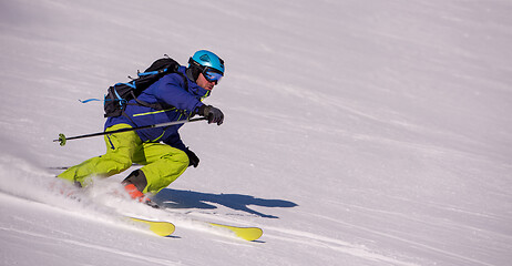 Image showing Skier having fun while running downhill