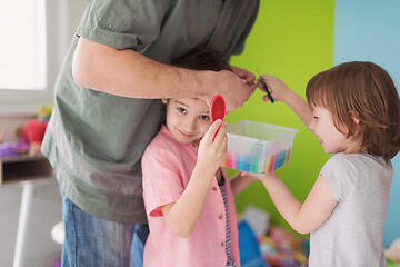 Image showing sister and brother havin fun and play hairstylist game at home