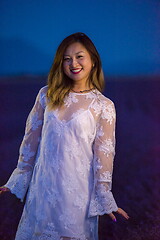 Image showing portrait of and asian woman in lavender flower field