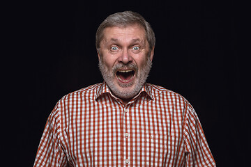 Image showing Close up portrait of senior man isolated on black studio background