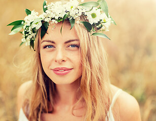 Image showing happy woman in wreath of flowers