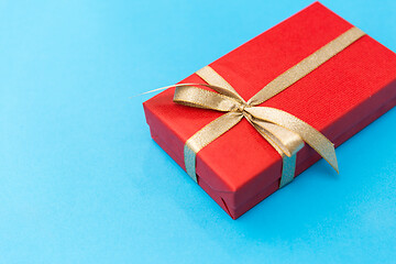 Image showing christmas red gift box on blue background