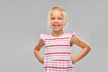 Image showing smiling little girl in striped dress