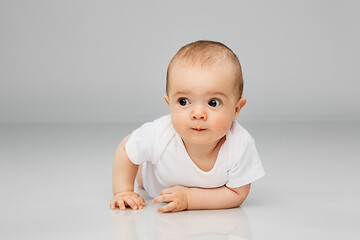 Image showing sweet little baby lying on floor