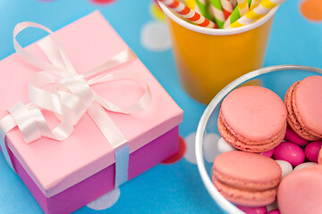 Image showing birthday gift, macarons and paper straws for party