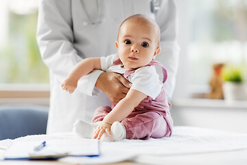 Image showing female pediatrician doctor with baby at clinic