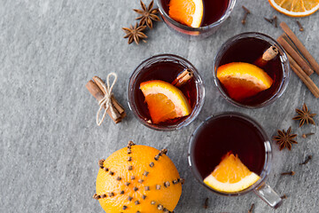 Image showing hot mulled wine, orange slices, raisins and spices