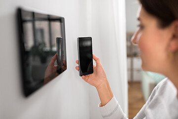 Image showing woman using tablet computer and smartphone