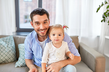 Image showing father with little baby daughter at home