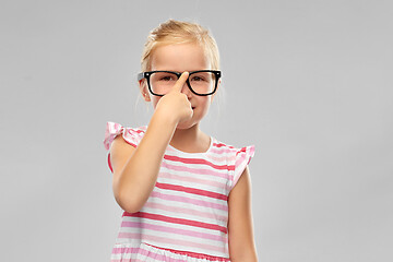 Image showing smiling cute little girl in black glasses