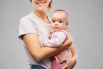 Image showing happy young mother holding little baby daughter