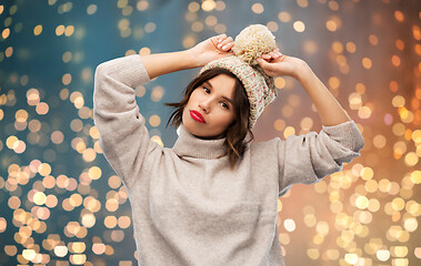 Image showing young woman in knitted winter hat and sweater